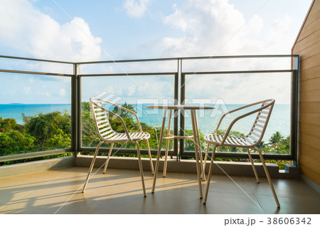 Beautiful outdoor patio with chair and table Beautiful outdoor patio with chair and table 38606342