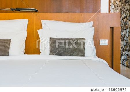 Confortable white pillow on bed 38606975