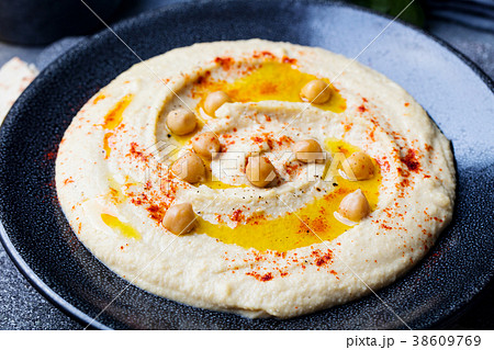 Hummus, chickpea dip, with spices and pita 38609769