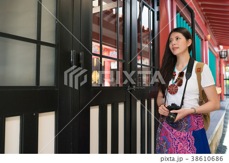 Female photographer in Naminoue Shrine. Female photographer in Naminoue Shrine. 38610686