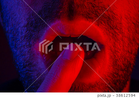 Macro close up on man with seductive expression 38612594