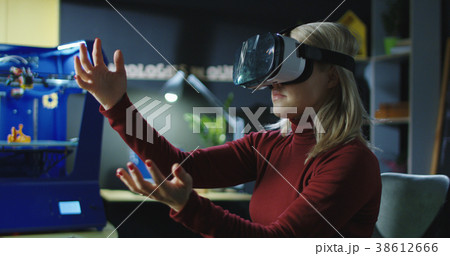 Laboratory employee working in VR glasses 38612666