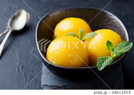 Mango ice cream, tropical fruit sorbet Black bowl 38612959
