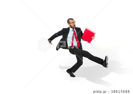 Businessman running with a folder on white 38615688
