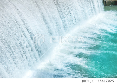 Waterfall on a big dam 38617025