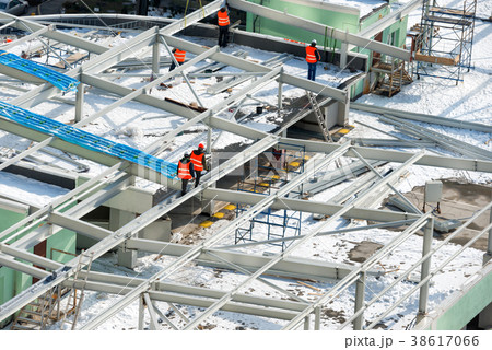 Workers on the building roof Workers on the building roof 38617066