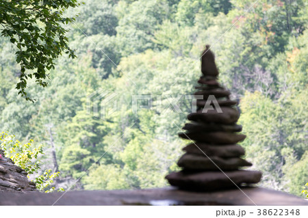 Pile of rocks by a waterfall 38622348
