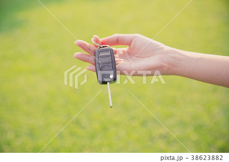 hand holding car key hand holding car key 38623882