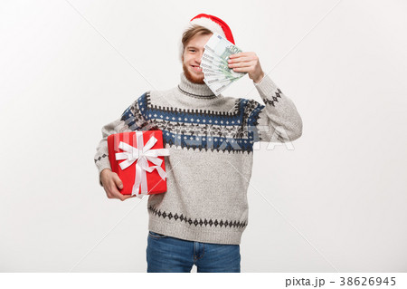 Holiday Concept - young beard man holding a 38626945