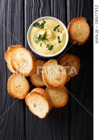 Easy appetizer crostini and cheese sauce close-up Easy appetizer crostini and cheese sauce close-up 38627912