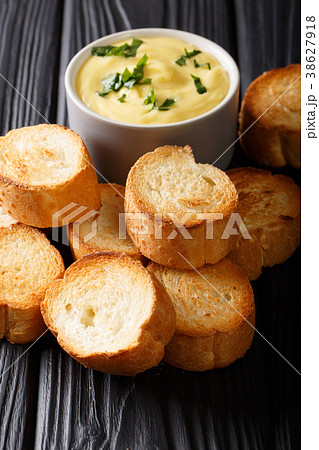Easy appetizer crostini and cheese sauce close-up 38627918
