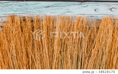 Broom twigs on a wooden board background Broom twigs on a wooden board background 38628170