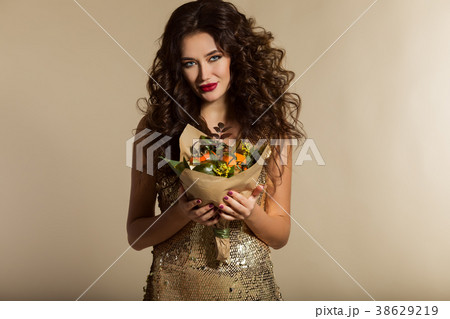 Portrait of beautiful girl is wearing golden dress Portrait of beautiful girl is wearing golden dress 38629219