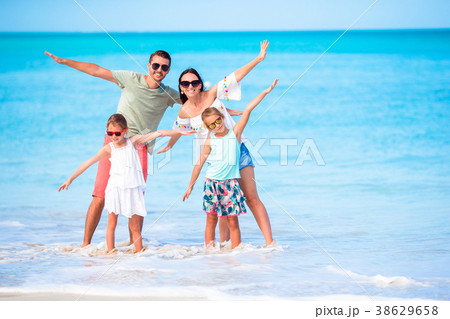 Young family on beach vacation have a lot of fun Young family on beach vacation have a lot of fun 38629658