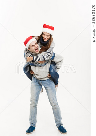 Christmas Concept - Full-length Young happy couple Christmas Concept - Full-length Young happy couple 38630170