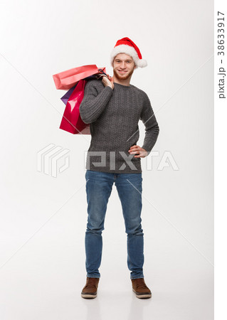 Christmas Concept - Young handsome beard man happy 38633917