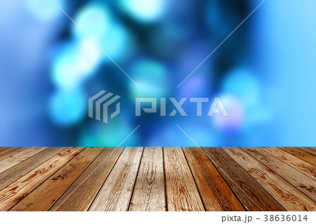 Wooden table on blue bokeh background Wooden table on blue bokeh background 38636014