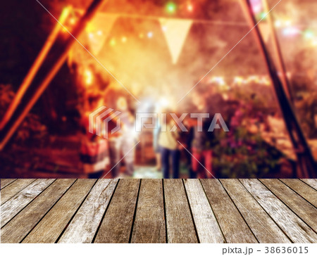 Wooden table top on blurred new year celebration Wooden table top on blurred new year celebration 38636015