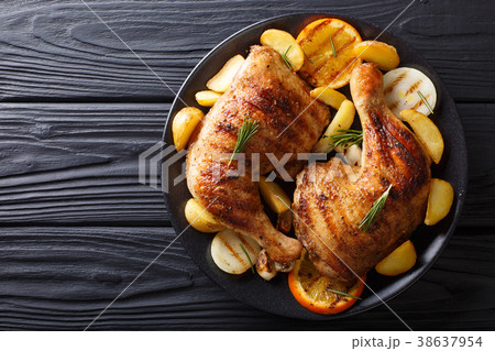 Spicy bbq chicken legs with grilled oranges, onion 38637954