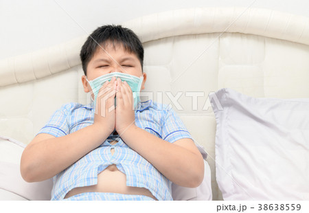 obese fat boy sneeze with face mask protection obese fat boy sneeze with face mask protection 38638559