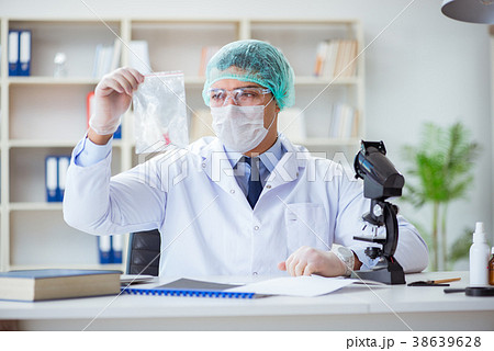 Forensics investigator working in lab on crime 38639628