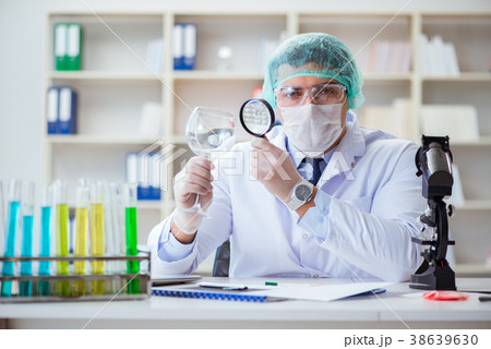 Forensics investigator working in lab on crime 38639630