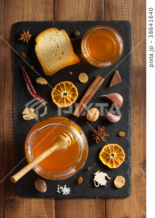 glass jar of honey on wood glass jar of honey on wood 38641640