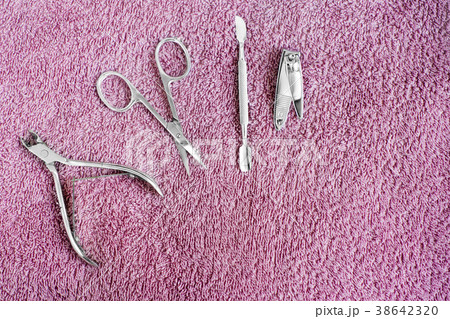 Set of manicure instruments on towel. Nail care 38642320