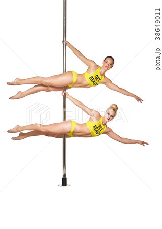 beautiful pole dancers in yellow costumes 38649011