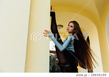 Graceful girl ballerina posing on the arches of 38649299
