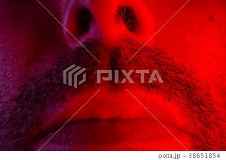 Macro closeup on man mouth with serious expression Macro closeup on man mouth with serious expression 38651854