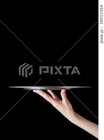 Female hand holds stainless steel catering tray Female hand holds stainless steel catering tray 38652064