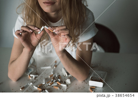 Glad woman getting herself free from addiction 38654654