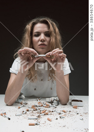 Serene female with tobacco obsession 38654670