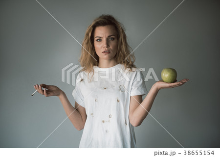 Severe female person choosing lifestyle 38655154