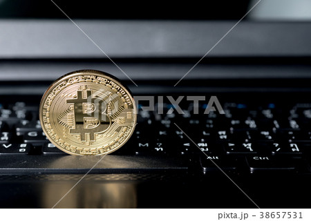 close up of Golden Bitcoin money on computer. close up of Golden Bitcoin money on computer. 38657531