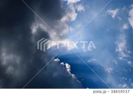 Clouds gathered in the sky under the sun. Clouds gathered in the sky under the sun. 38659537