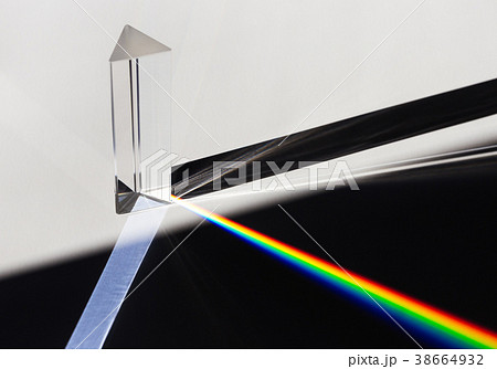 A prism dispersing sunlight splitting into a 38664932