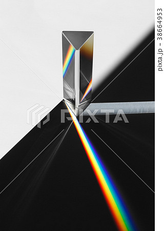 A prism dispersing sunlight splitting into a 38664953