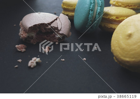 Crumbled macaroons on stylish dark background 38665119