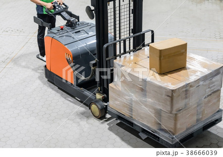 Electrical Forklift truck with boxes on pallet Electrical Forklift truck with boxes on pallet 38666039