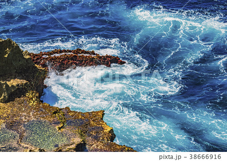 Waves struck on the rocks on the cliff Waves struck on the rocks on the cliff 38666916