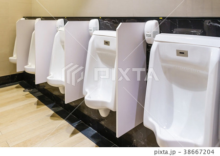 contemporary interior of white urinals in toilet contemporary interior of white urinals in toilet 38667204