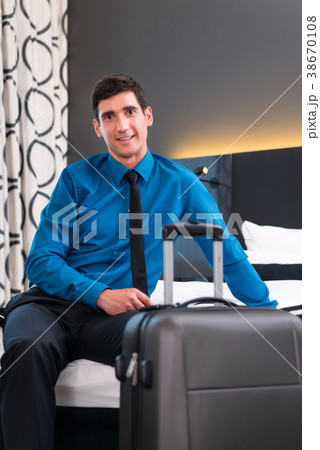 Businessman at arrival in hotel room 38670108