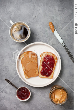 Toast with peanut butter and jam 38670173