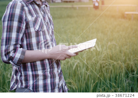 agriculture technology, farmer man using tablet. 38671224