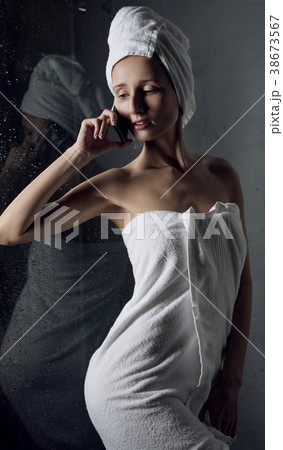 Slim girl wrapped in white towel cropped view 38673567