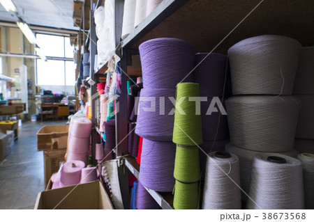 Spools with color thread at knitting shop view Spools with color thread at knitting shop view 38673568