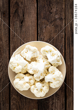 Fresh cauliflower on wooden board 38674164