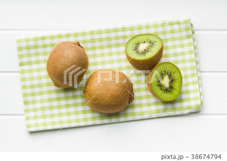 Halved kiwi fruit. 38674794